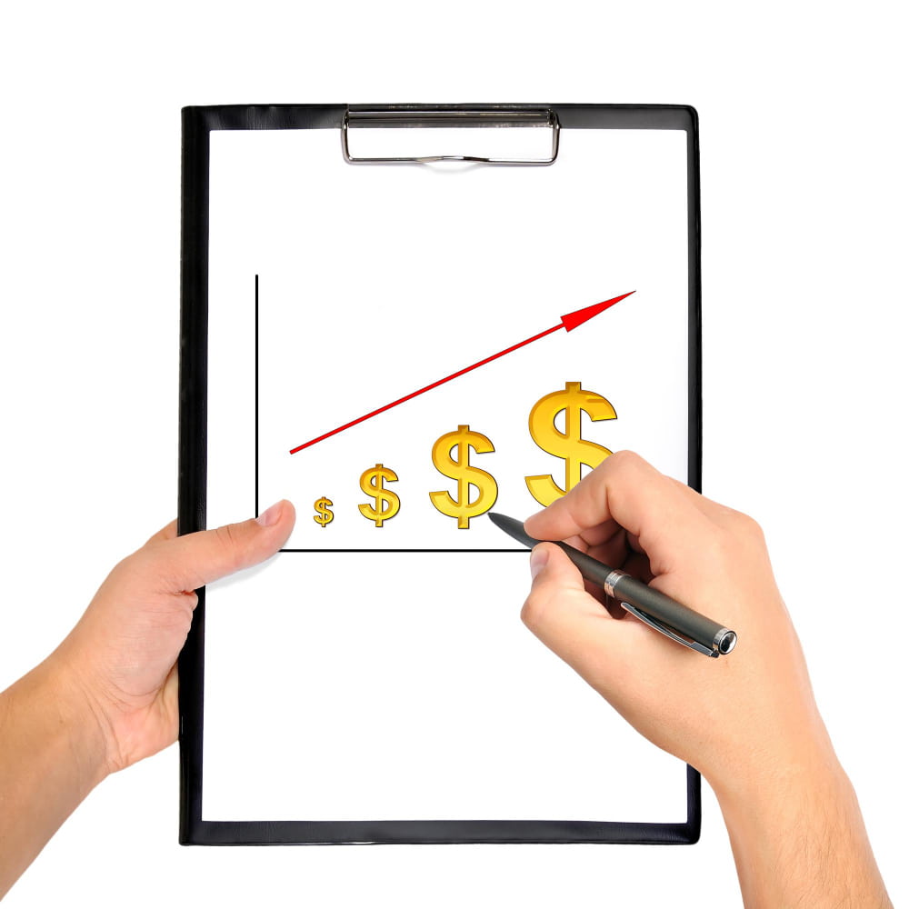 يد تمسك ورقة مرسوم عليها دولارات