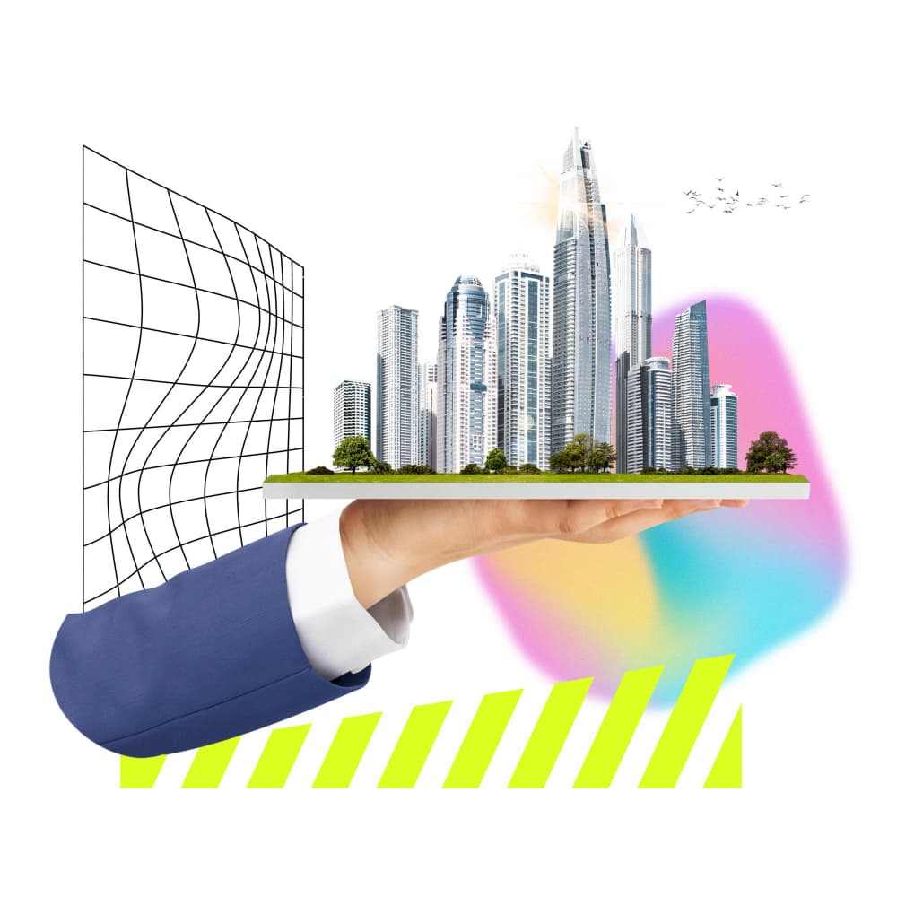 يد تحمل مجسم مدينة سكنية